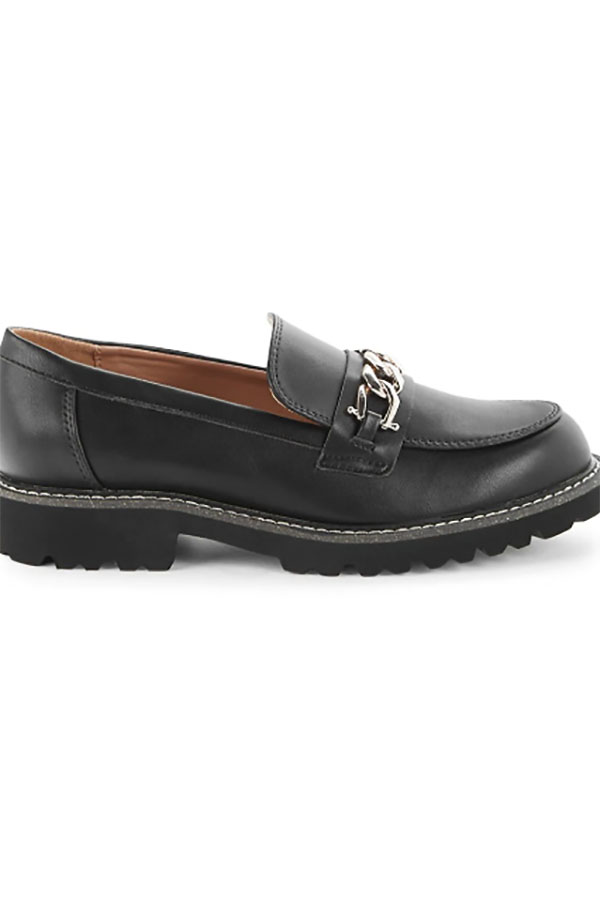 Close-up of black loafer shoe with metal curb chain.