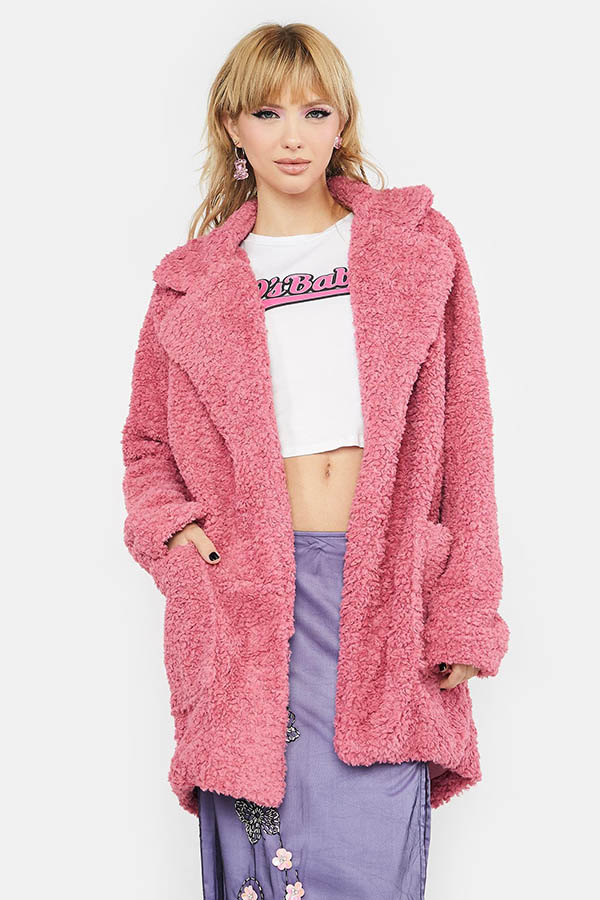 Long pink coat with teddy bear texture.