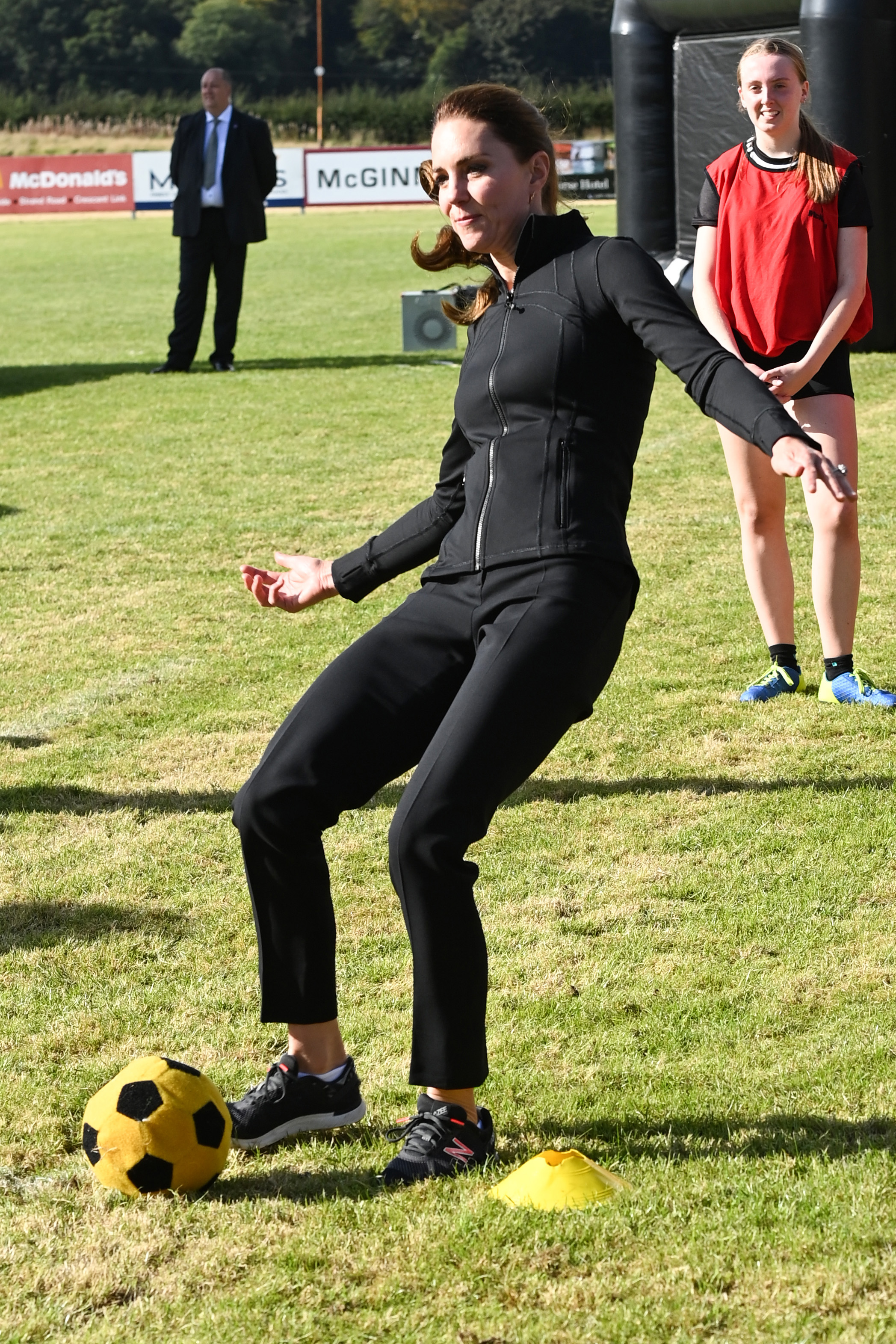 Kate kicks a ball  as she visits the City of Derry Rugby Club on September 29, 2021 in Londonderry, Northern Ireland. (Photo: Pool/Samir Hussein/WireImage)