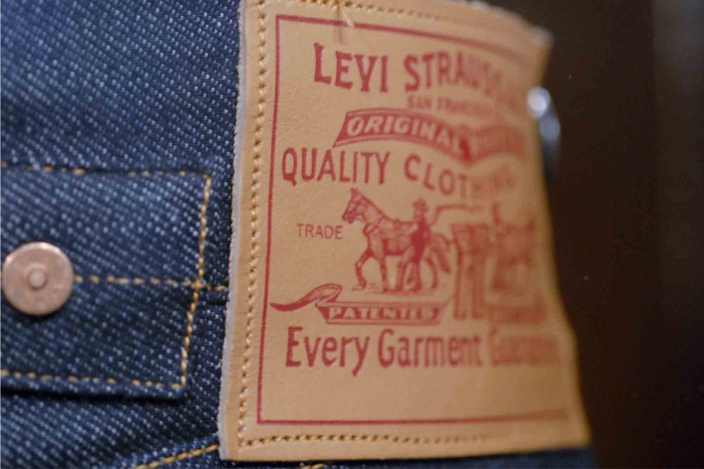Close-up of a Levi Strauss label on a pair of jeans with copper rivets