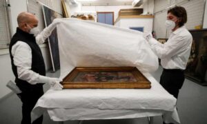 Museum staff pack the painting.