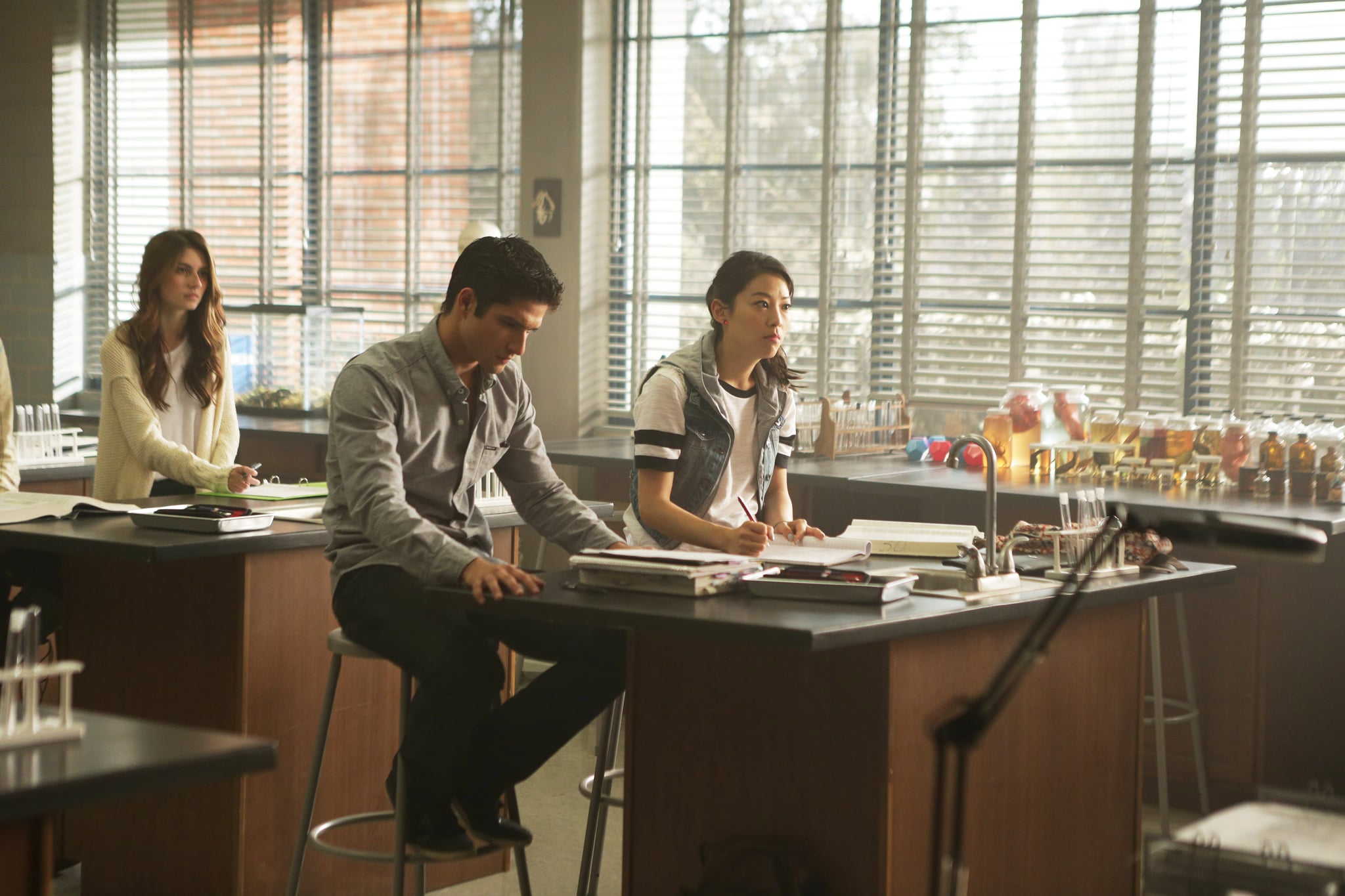 TEEN WOLF, Tyler Posey (center), Arden Cho (right), 'Required Reading', (Season 5, ep. 506, aired July 27, 2015). photo:  MTV / Courtesy: Everett Collection