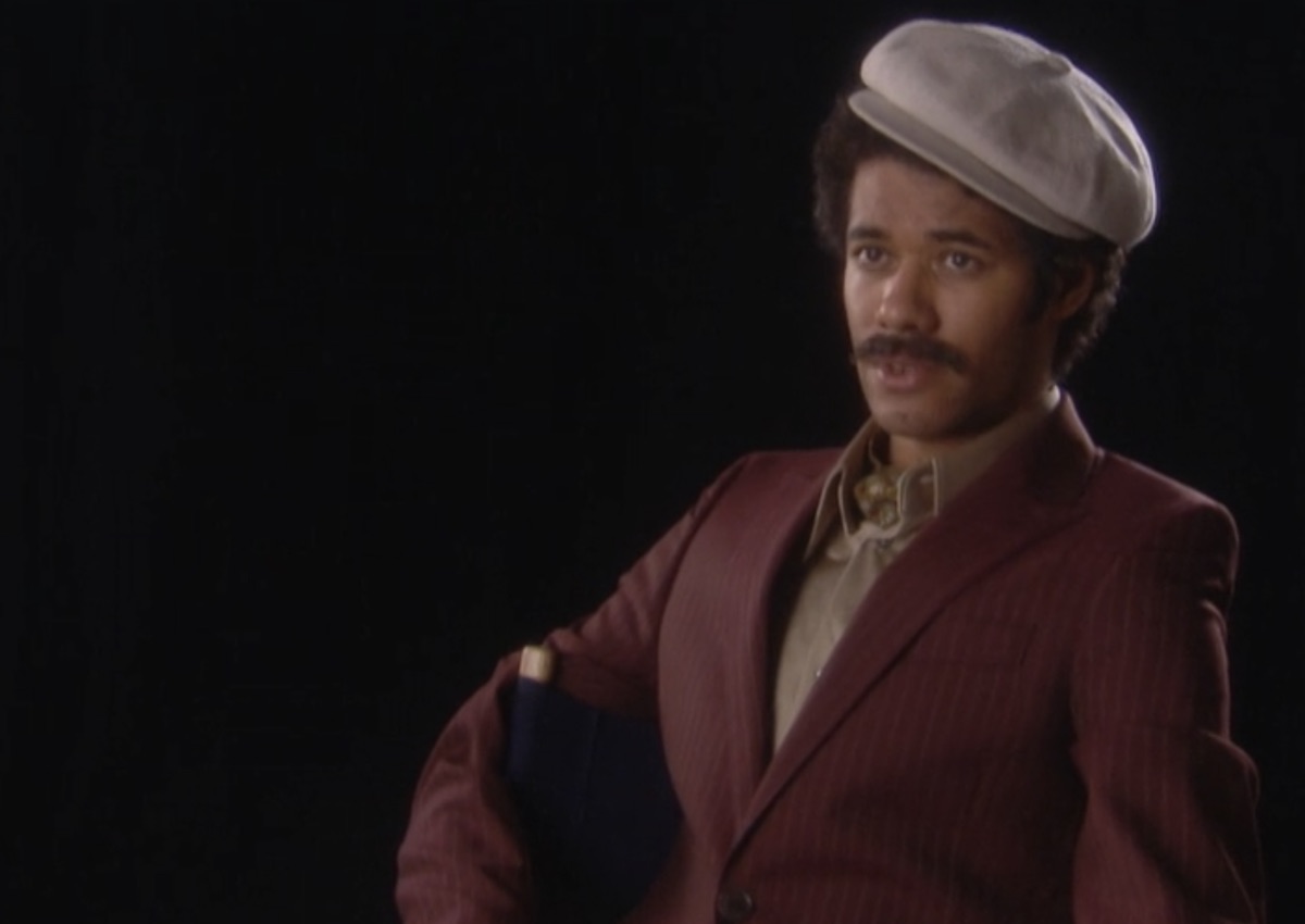 Richard Ayoade as Dean Lerner giving an interview on Garth Marenghi's Darkplace