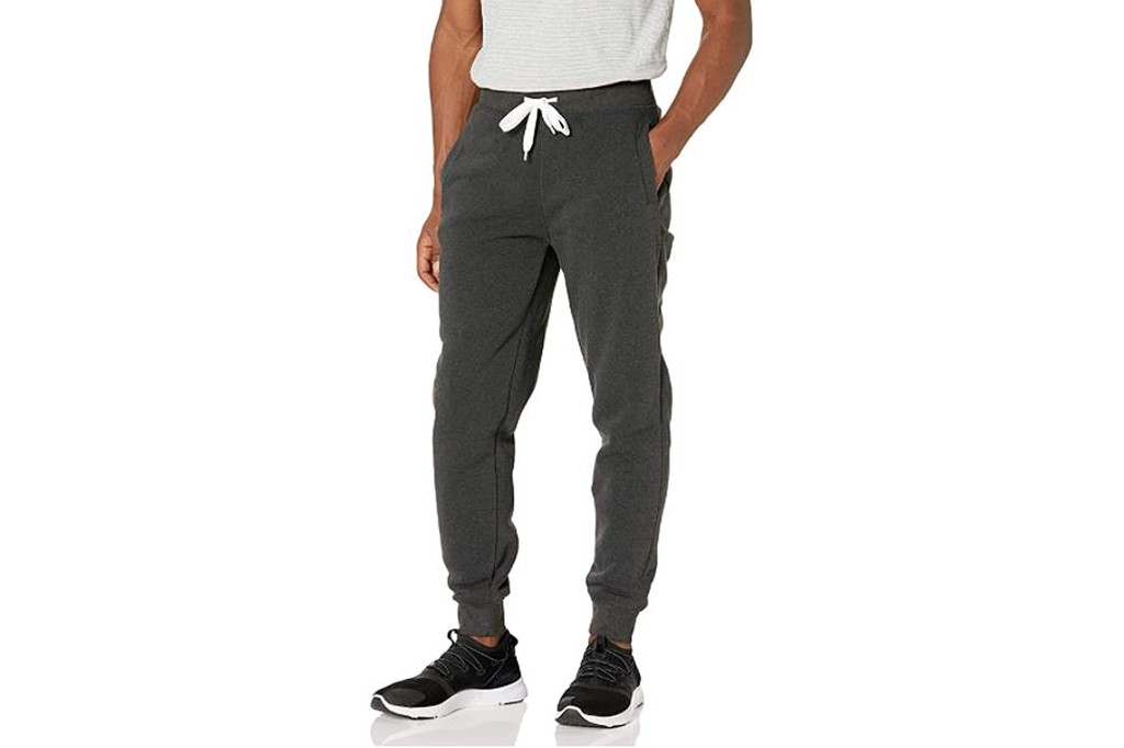 A man's lower body in gray sweatpants 