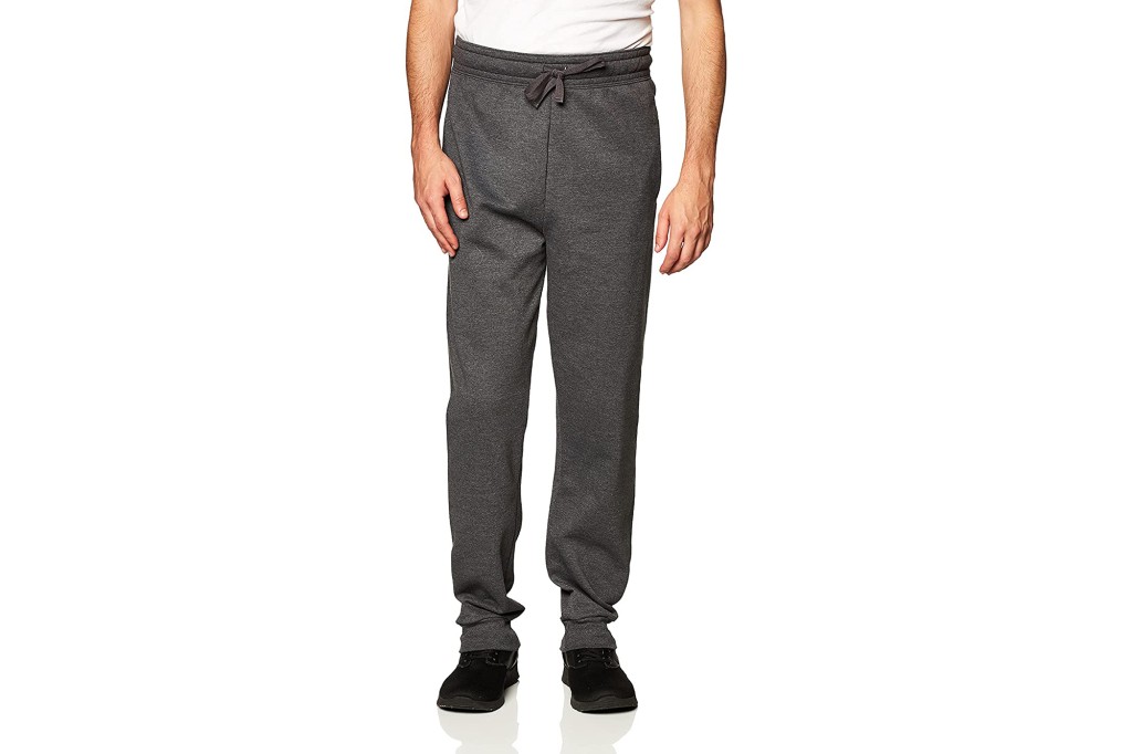 A man's lower body in a pair of gray sweatpants 