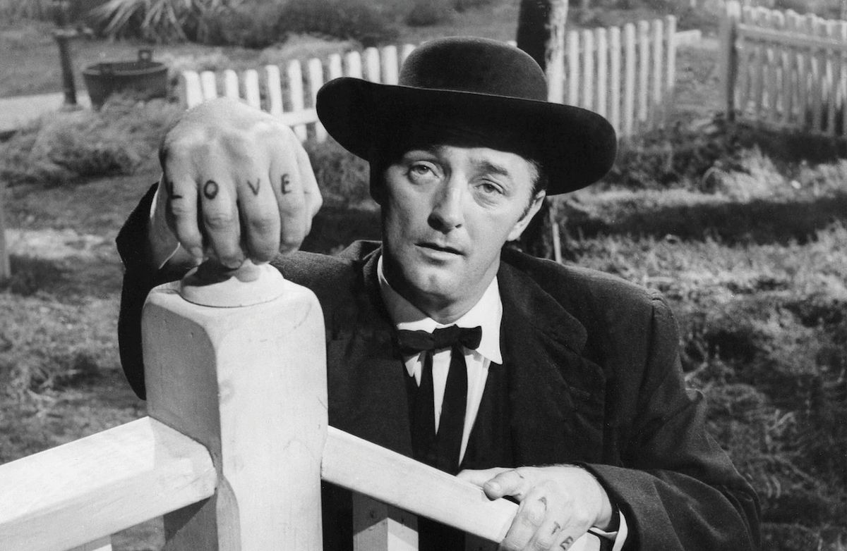 Robert Mitchum as Preacher Harry Powell in The Night of the Hunter (1955).