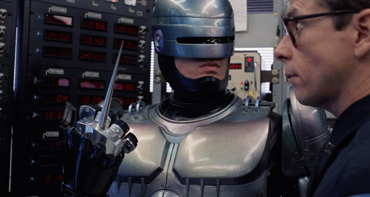 Robocop gives a guy the middle finger spear