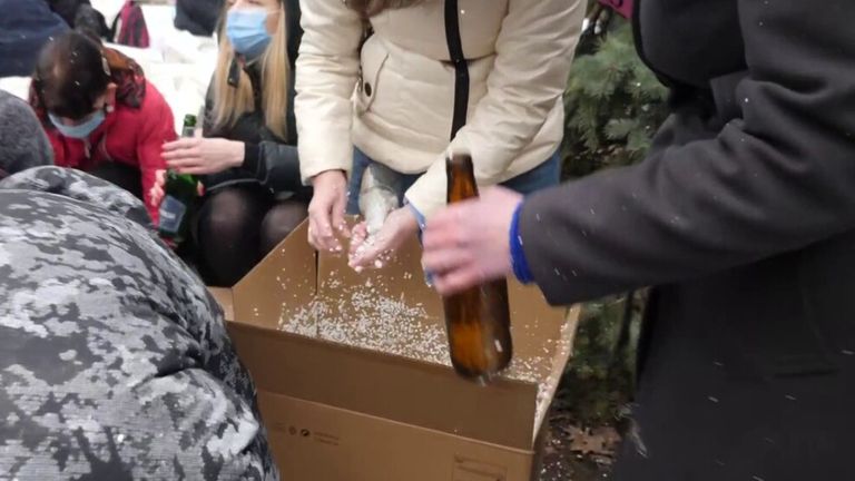 Ukrainian civilians are seen in Dnipro, central Ukraine, preparing Molotov cocktails in case of a Russian invasion.