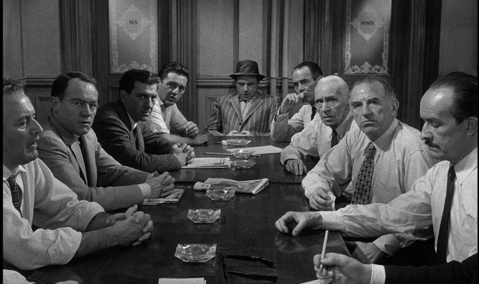 The 12 Angry Men of 12 Angry Men sit at a table