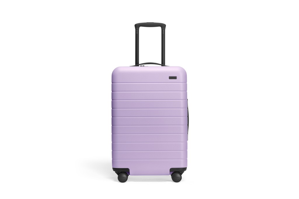 lavender colored carry-on suitcase from Away