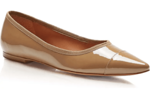 A pointy-toed, patent leather flat in dark beige