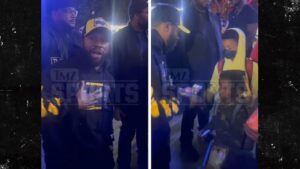 Floyd Mayweather Hands Out $100 Bills To Kids At Lakers Game