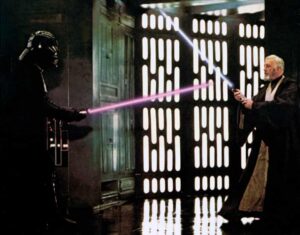 David Prowse and Alec Guinness as Darth Vader and Obi-Wan Kenobi in 1977’s Star Wars: Episode IV – A New Hope.