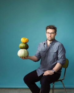 Joe Woodhouse sitting with vegetables