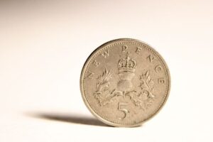 Close up of an old UK five pence coin