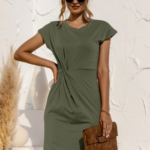Woman wearing olive green twist dress.