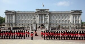 Guards standing outside of Buckingham Palace