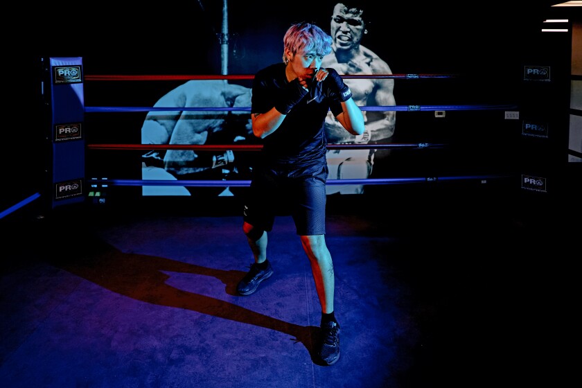 Michael Le, 21, of Los Angeles practices a boxing stance.