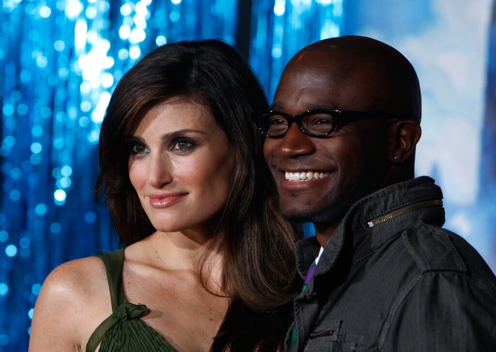 HOLLYWOOD - NOVEMBER 17: Actor Idina Menzel and Taye Diggs arrive at the World Premiere of Disney's "Enchanted" held at the El Capitan theatre on November 17,2007 in Hollywood, California.