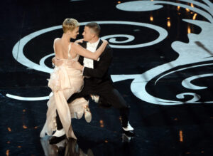 HOLLYWOOD, CA - FEBRUARY 24:  Actress Charlize Theron and actor Channing Tatum dance onstage during the Oscars held at the Dolby Theatre on February 24, 2013 in Hollywood, California.