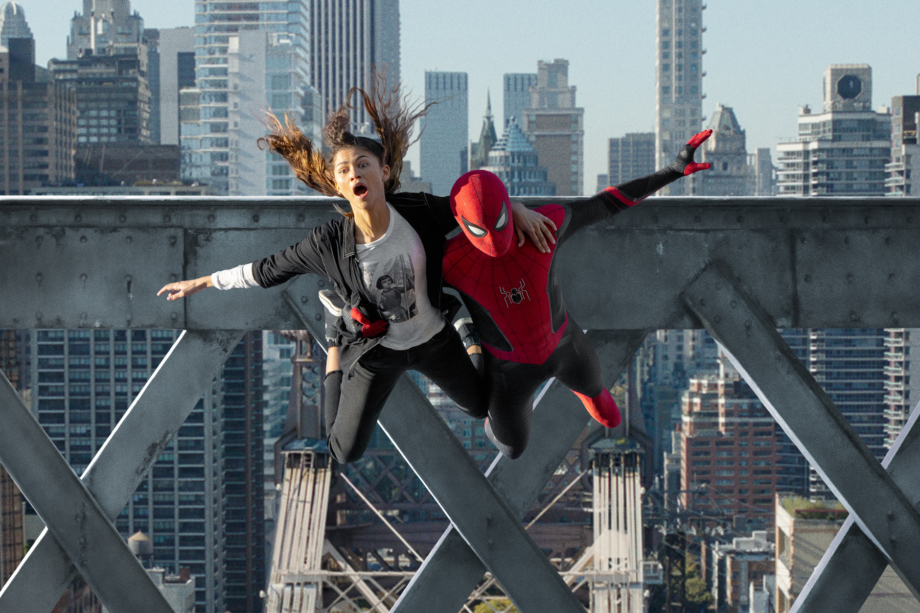 MJ (Zendaya) and Spider-Man jump off the bridge in Columbia Pictures' SPIDER-MAN: NO WAY HOME.