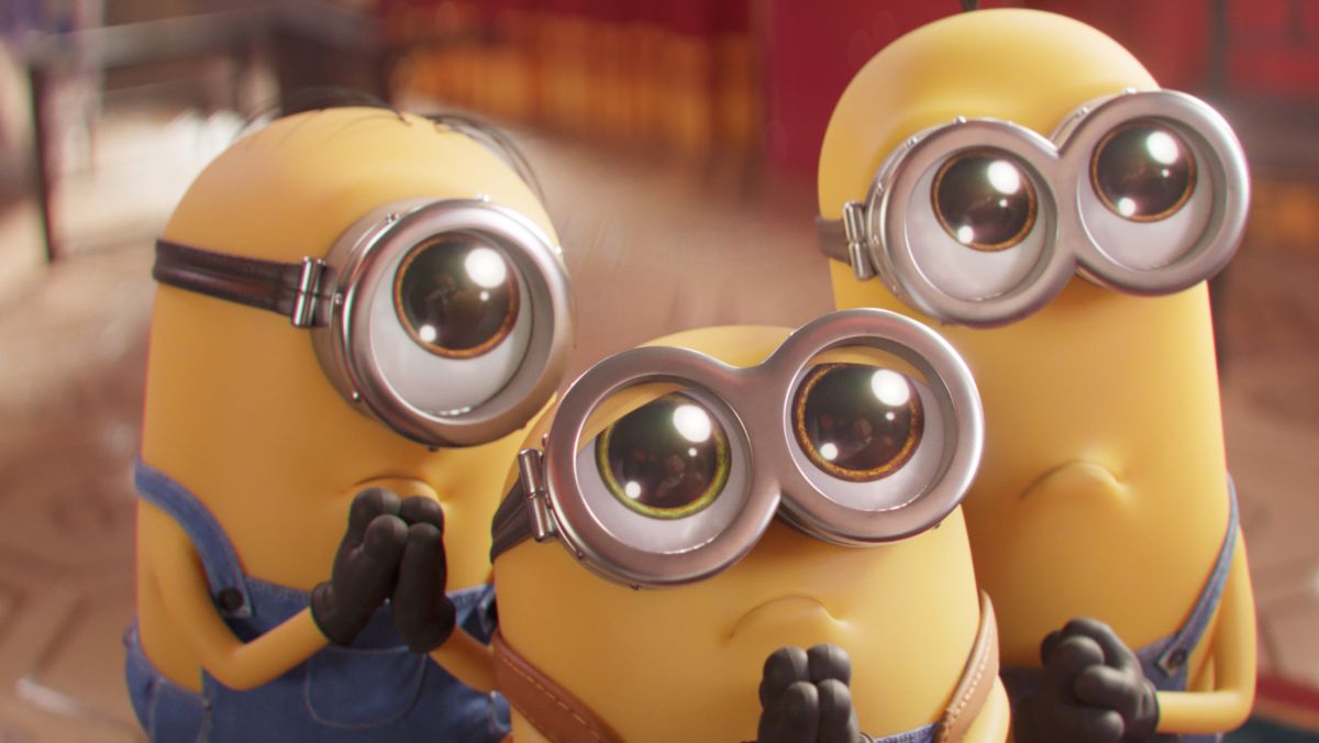 the minions look at someone with wide pleading eyes in minions: the rise of gru trailer