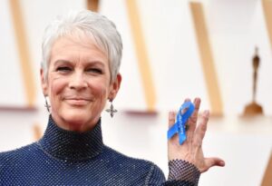 Jamie Lee Curtis wears a ribbon on her hand reading "#WithRefugees" at the 94th Oscars at the Dolby Theatre in Los Angeles on March 27.