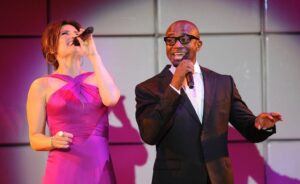 BEVERLY HILLS, CA - MARCH 21:  Actors Idina Menzel and Taye Diggs perform at the 20th Anniversary Alzheimer