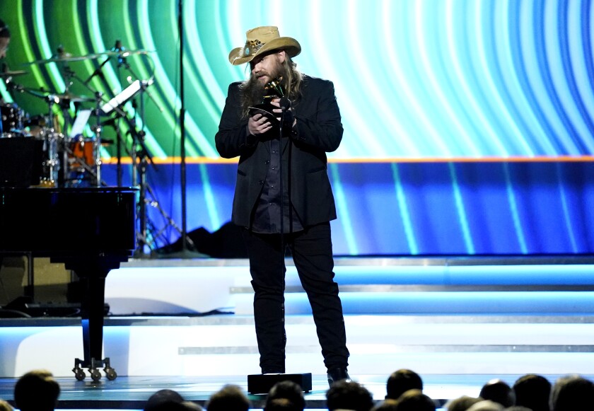 Chris Stapleton accepts the best country solo performance for "You Should Probably Leave"at the 64th Annual Grammy Awards.
