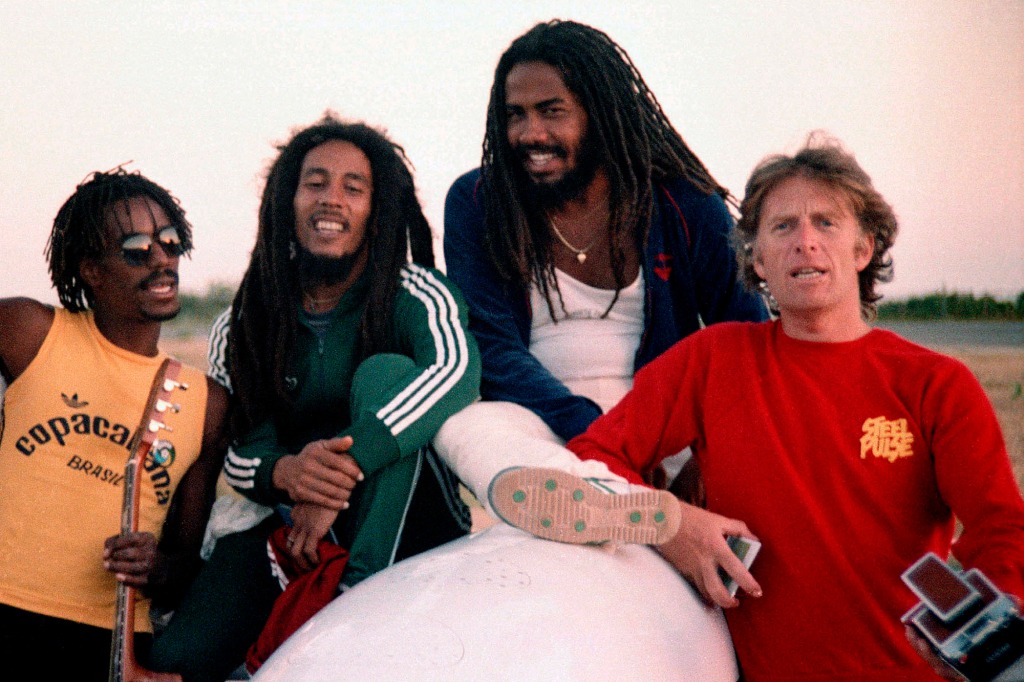 Chris Blackwell with (l-r) Junior Marvin, Bob Marley & Jacob Miller, en route to Brazil, 1980.