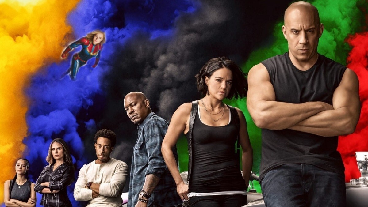 photo of fast 9 ensemble cast with captain marvel flying through the sky
