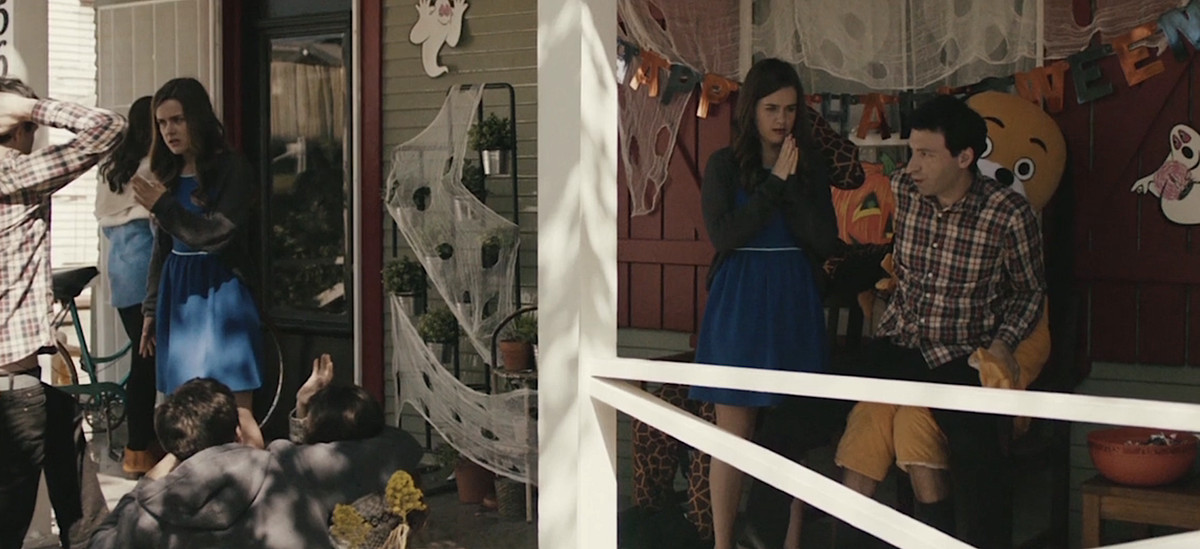 Rick (Alex Karpovsky) and Pollie (Zoe Jarman) argue on their porch, surrounded by different versions of themselves