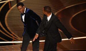 Will Smith, right, slaps US actor Chris Rock at the Oscars last month.