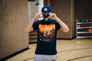 Rapper Logic wearing mask