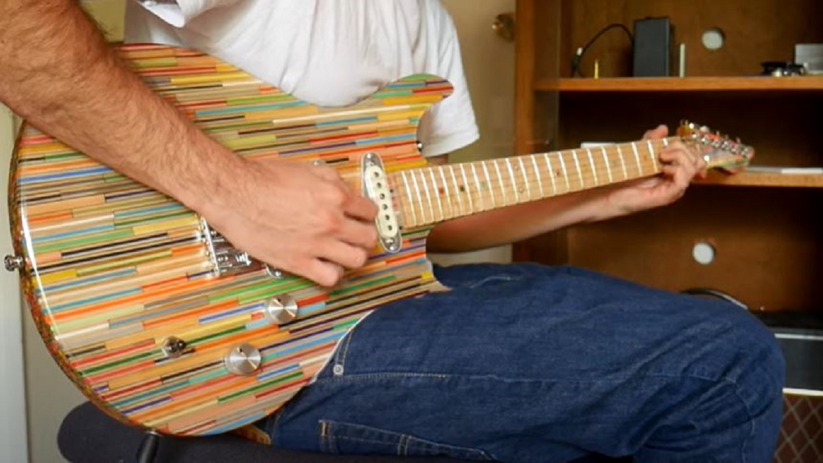 YouTuber Burls Art plays his colored pencil guitar.