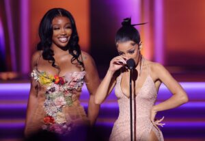 LAS VEGAS, NEVADA - APRIL 03: (L-R) SZA and Doja Cat accept the Best Pop Duo/Group Performance award for 'Kiss Me More' onstage during the 64th Annual GRAMMY Awards at MGM Grand Garden Arena on April 03, 2022 in Las Vegas, Nevada. (Photo by Rich Fury/Getty Images for The Recording Academy)