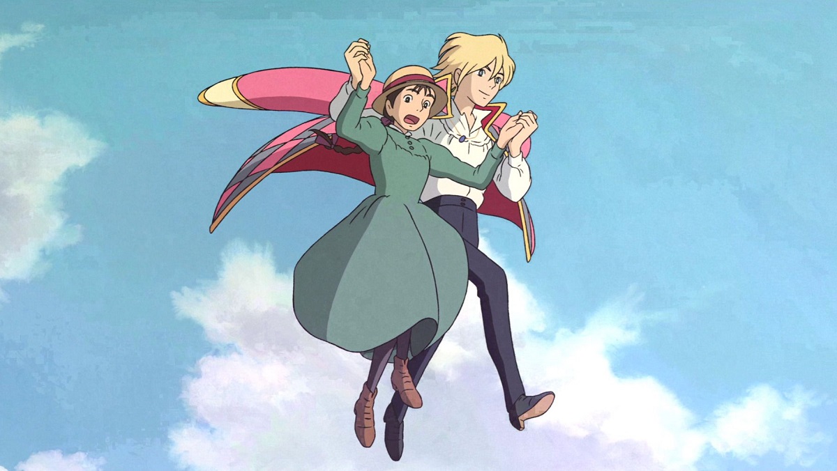 A blonde Howl and Sophie Hatter glide across the sky in Howl's Moving Castle.