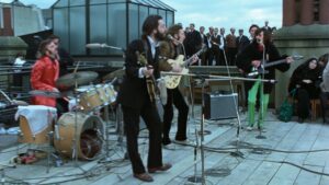The Beatles playing their rooftop concert - The Beatles: Get Back–The Rooftop Concert is coming to IMAX