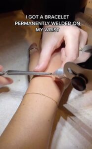 Jaclyn Forbes viral TikTok of the process of getting a permanent bracelet