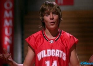 A close up of Troy Bolton as he wears his basketball jersey