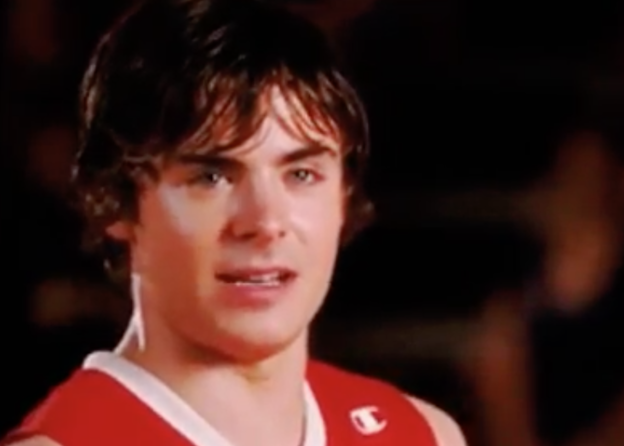 A close up of Troy Bolton as he's sweaty