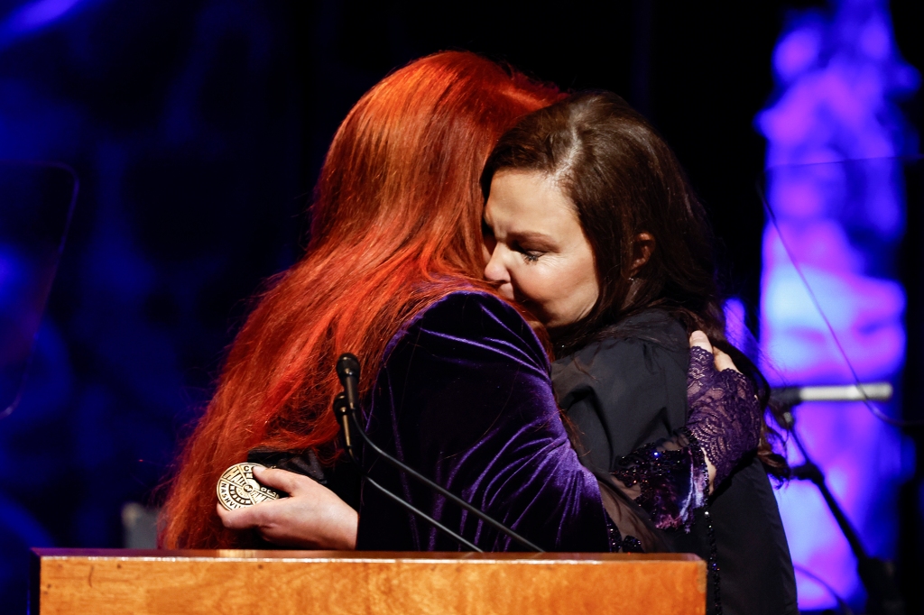 Ashley Judd, right, hugs sister Wynonna Judd during the Medallion Ceremony at the Country Music Hall Of Fame Sunday, May 1, 2022, in Nashville, Tenn. (Photo by Wade Payne/Invision/AP)
