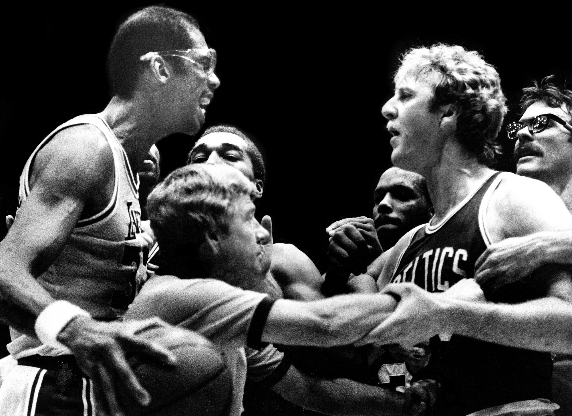 Kareem Abdul-Jabbar and Larry Bird exchange words on the court in 1984