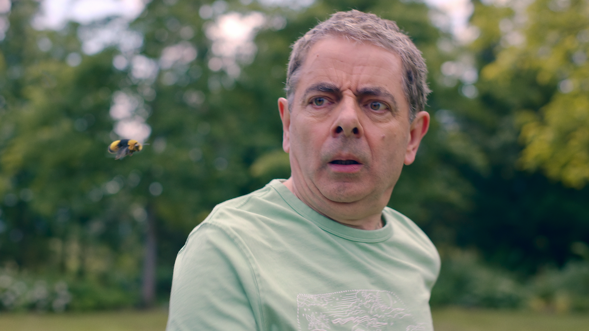 A bee haunts Rowan Atkinson in the Netflix series Man Vs Bee