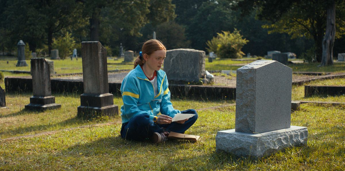 max sitting next to billy’s grave