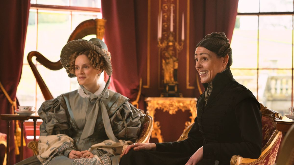 ann walker and anne lister in gentleman jack sit at a table for tea