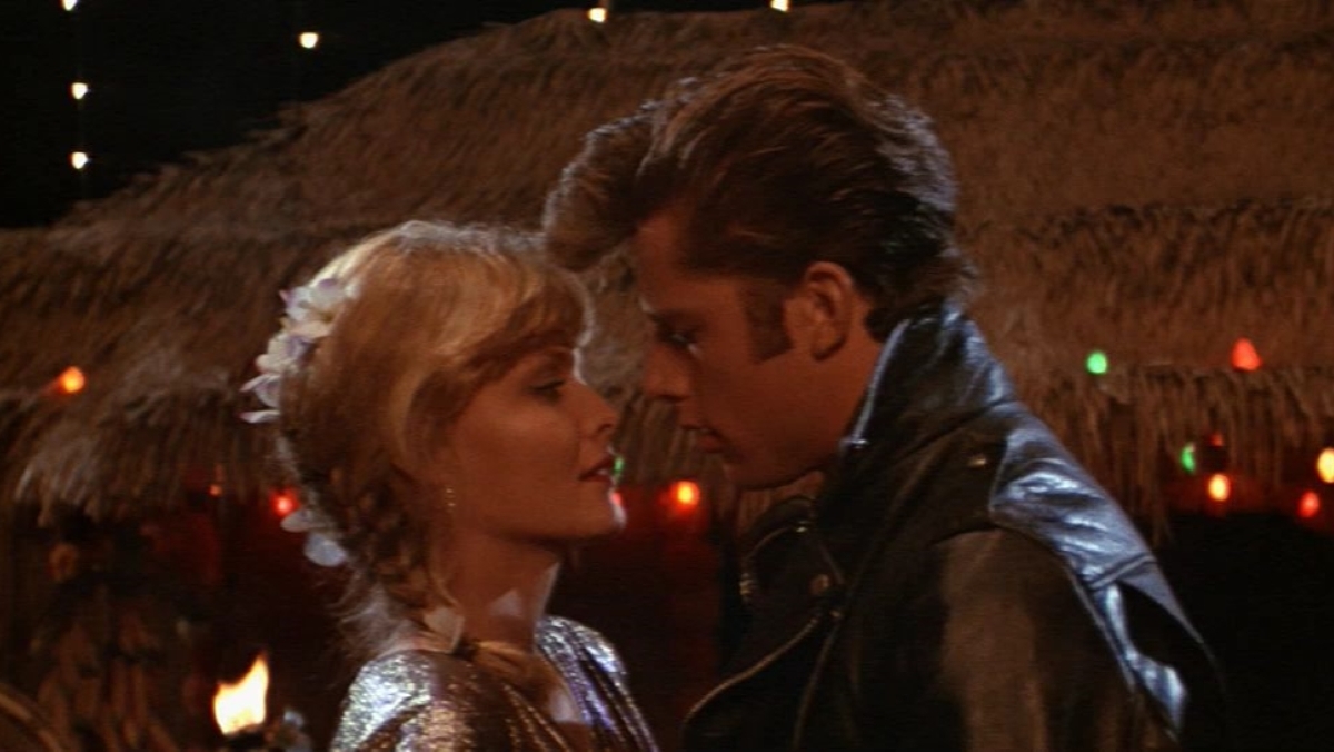 Maxwell Caulfield and Michelle Pfeiffer about to kiss in the finale of Grease 2