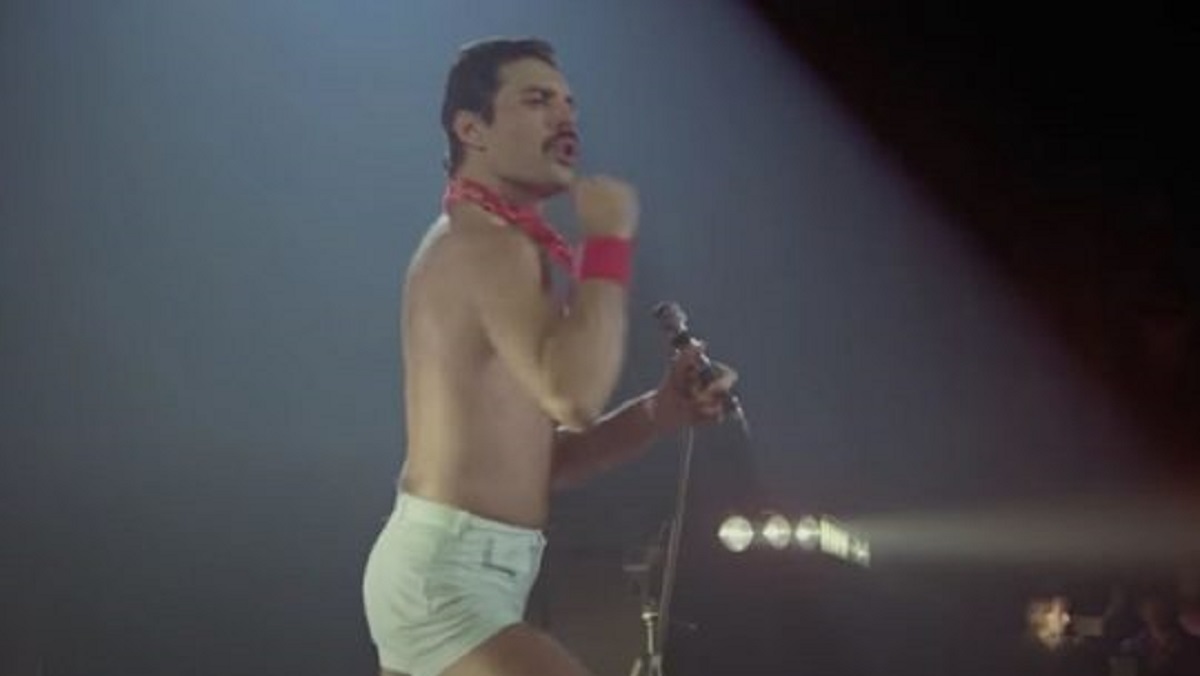 Freddie Mercury performs We Will Rock You in concert.