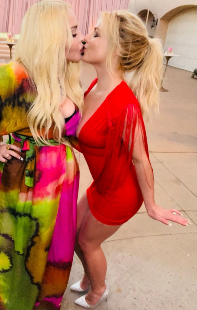 Madonna and Britney Spears kissed at the "I'm a Slave 4 U" singer's wedding on Thursday.