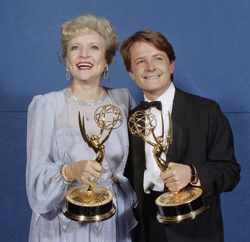Michael J. Fox and Betty White with Emmys in 1986